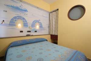 Standard quad with balcony, and private facilities (shower)